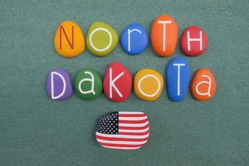 North Dakota, souvenir with colored stone letters over green sand