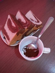 Sliced bread with jam and cup of coffee 