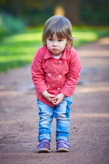 Fototapeta premium Little girl looking for her parents