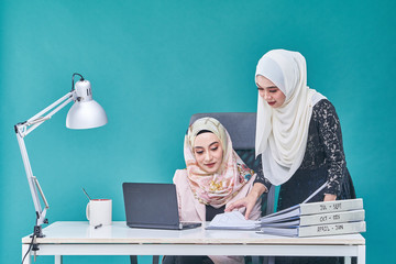 Office Lady with bundle of file on the table and laptop