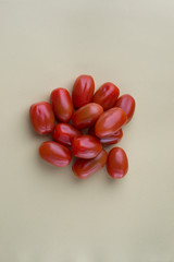 red bright tomatoes on a monotone background