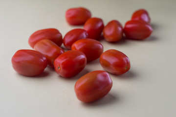 red bright tomatoes on a monotone background
