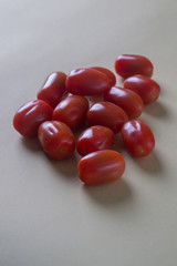 red bright tomatoes on a monotone background