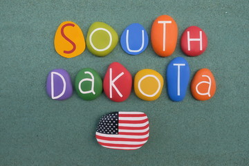 South Dakota, souvenir with colored stone letters over green sand