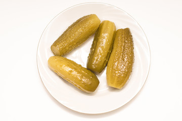 Delicious, crunchy, pickled cucumbers on a plate.