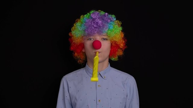 portrait of a clown on a black background