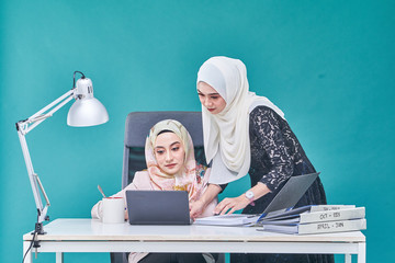 Office Lady with bundle of file on the table and laptop