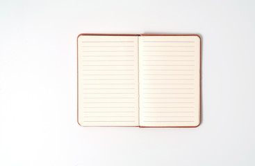 top view blank orange leather diary on white desk