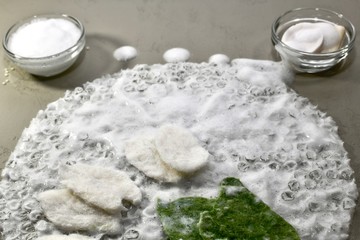 Arrangement of the working area for wallowing wool from the substrate soap foam wool, fragment, front view at an angle.