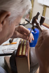 close-ups of goldsmith work in an artisan workshop in Toledo