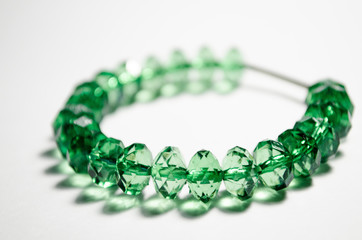 Bracelet made from green faceted plastic beads. Crystals. Bracelet for a girl with a metal insert....