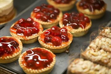 close up of red fruit tartalets