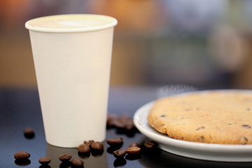 close up of empty coffee cup with beans