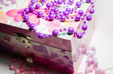 Delicate pink jewelry box for girls. Necklaces that lie near and on the casket. Delicate...