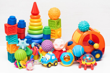 Various children toys on white background.