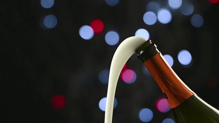 a bottle of champagne has opened and sizzles against the backdrop of the night's festive sparkles - Powered by Adobe