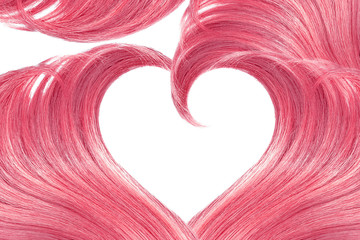 Pink hair in shape of heart, isolated on white background