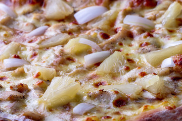 Hawaiian pizza pizza close up - pineapple - on a wooden background  - closeup
