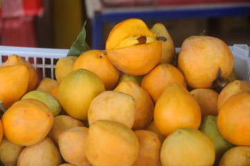 Naklejka na ściany i meble Egg fruit, Canistel, Yellow Sapote (Pouteria campechiana Baehni) in the market.