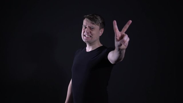 Thumbs up on black background guy sign pease