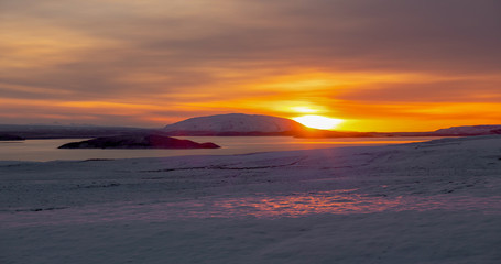 Obraz premium sunset over the snowy fields