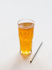 Herbal fruit drink pineapple with Basil in a glass on a white background