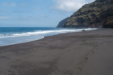 Beach with black volcanic sand on Tenerife island