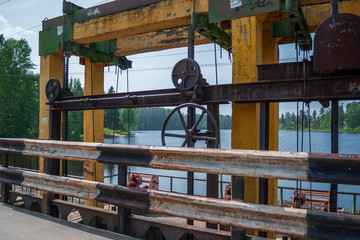 A large image of the crane's lift mechanism on the dam on a warm May day