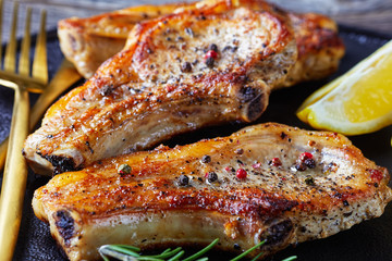 broiled pork rib chops on a plate