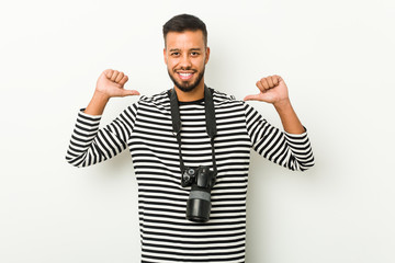 Naklejka premium Young south-asian photographer feels proud and self confident, example to follow.