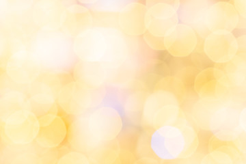 Fototapeta na wymiar Bokeh fashion. Gold glitter abstract lights. Festive blur background. Soft yellow christmas backdrop.