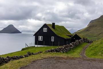House on edge of Velbastaður with view towards island of Koltur on the Faroe Islands