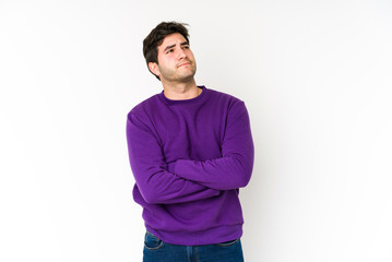 Fototapeta premium Young man isolated on white background dreaming of achieving goals and purposes