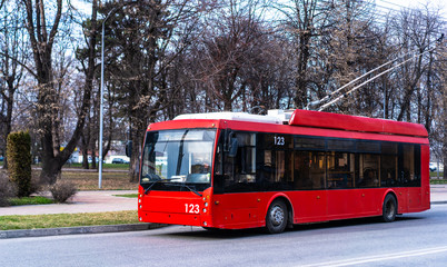 Fototapeta na wymiar Trolleybus is moving along the road