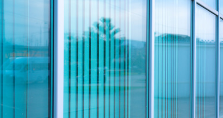 Glass window with shutters behind them.