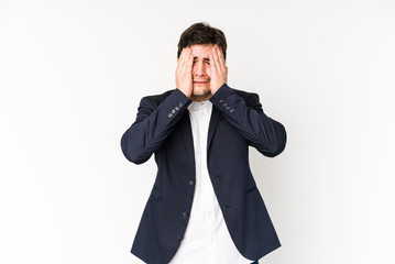 Young business man isolated on white background whining and crying disconsolately.