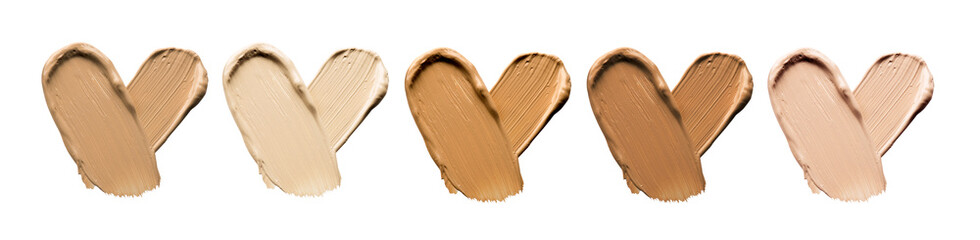 Foundation smears palette close-up. Heart shaped make-up smudge, smear. Cosmetic liquid bb cream beige color smudges, strokes. Colorful Liquid Make up concealer isolated on white background. 