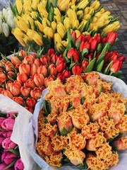 Multi-colored tulips on the shelves. Bouquets. Gift for the holidays