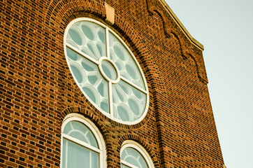Bricked Church with Traditional Circular Window Glass