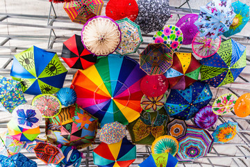 fun décor: ceiling covered with many colors and patterns of umbrellas 