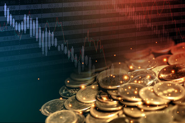 Pile of coins on black background with red-blue light, dropped financial graph and stock table. Double exposure with copy space. Money concept.