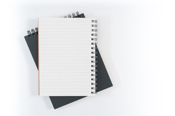 school notebook on a blue background, spiral notepad on a table