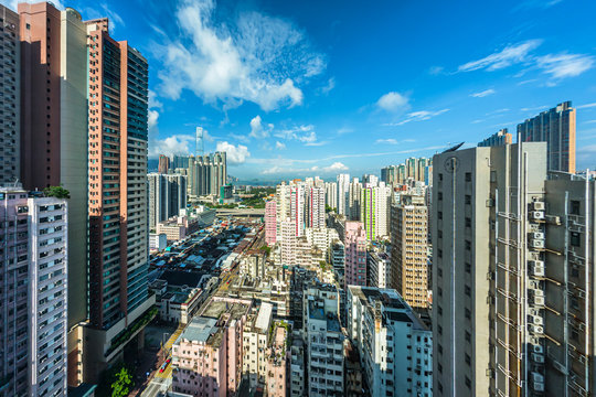 Cityscape of Hong Kong buildings with cloudy blue sky in morning, high angle view taken from a hotel in Yau Ma Tei (Kowloon, Hong Kong)