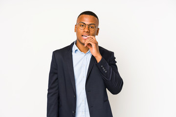 Young business latin man isolated on white background biting fingernails, nervous and very anxious.