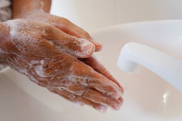 Fototapeta premium Woman washing hands with soap. Hygiene. Cleaning Hands. Prevent the new coronavirus.