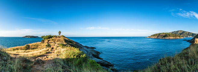 Fototapeta premium Panorama landscape of Promthep cape in morning with sunlight and beautiful blue sky (Phuket, Thailand)