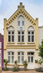Fototapeta na wymiar Facade of a historic house in Friedrichstadt, Germany