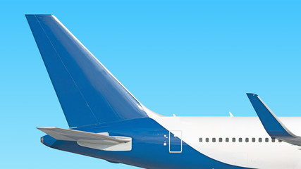 modern airplane tail side view isolated on blue sky background Passenger jet plane fuselage part Commercial aircraft blank blue fin paint scheme Luxury business jet aft body Aviation design reference
