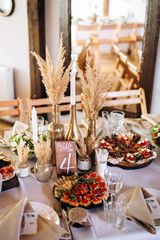 Beautiful wedding table decoration and decor in boho or rustic style