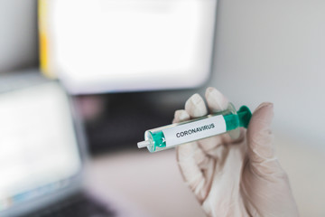 Coronavirus COVID-19 SARS virus vaccination cure medicine gloved hand hospital epidemic pandemic laboratory